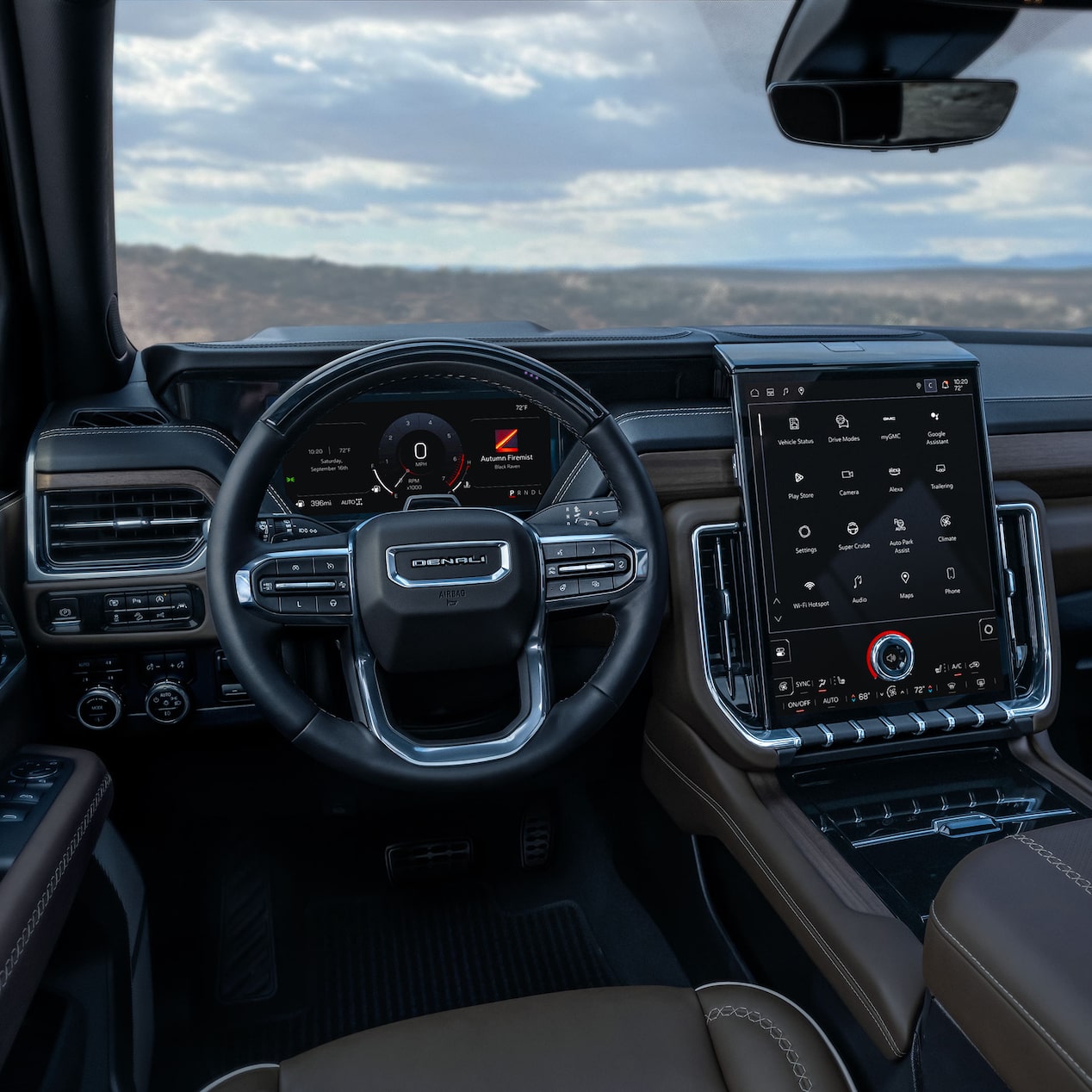 Interior View of the Steering Wheel and Infotainment Screen in the GMC Yukon Large SUV