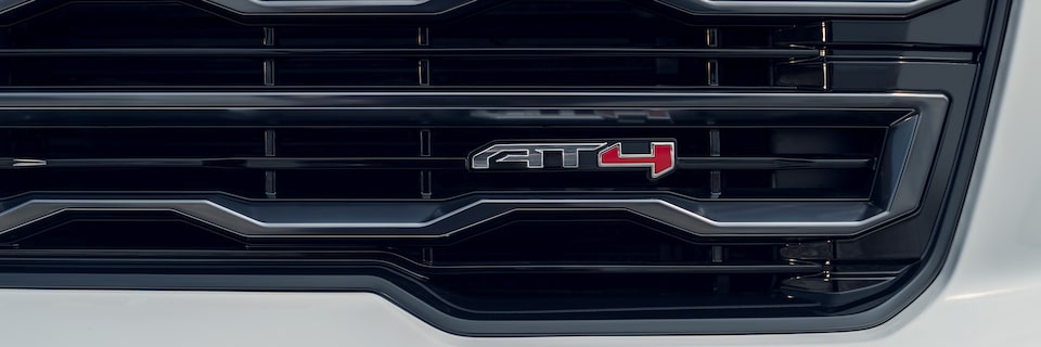 Close-up of the AT4 Badging on the Acadia Mid-Size SUV Grille