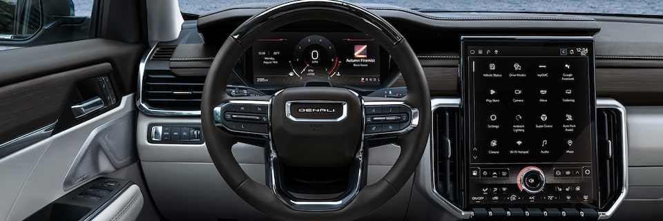 Drivers Side View of the Interior Steering Wheel and Infotainment System