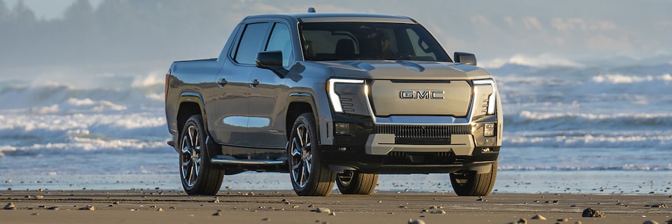 Three-Quarters Front View of the GMC Sierra EV Denali Edition 1 Parked on an Icy Tundra