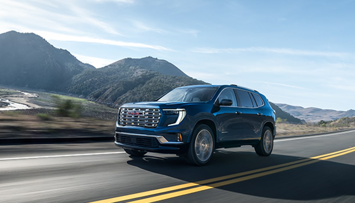 GMC SUV Driving on Cliffside Road