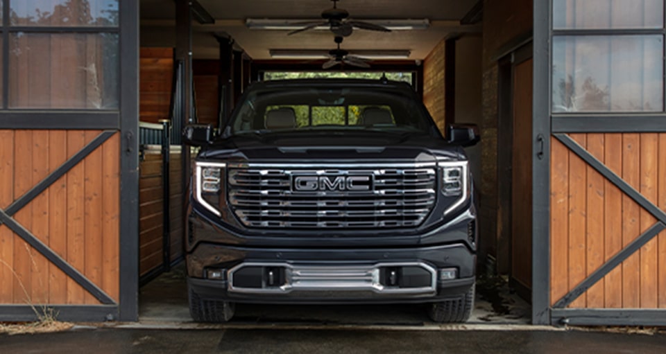 A Black GMC Truck Parked In a Garage