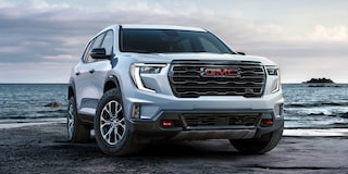 Front Three-Quarters View of the GMC Acadia AT4 Mid-Size Off-Road SUV Parked on a Beach