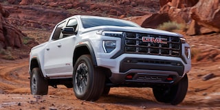 Exterior Front Three-Quarters View of the GMC Canyon Mid-Size Truck Parked in the Desert
