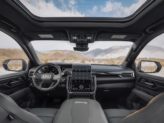 Interior View of the Front Row Seats and Dashboard in the GMC Yukon AT4 Full-Size Off-Road SUV