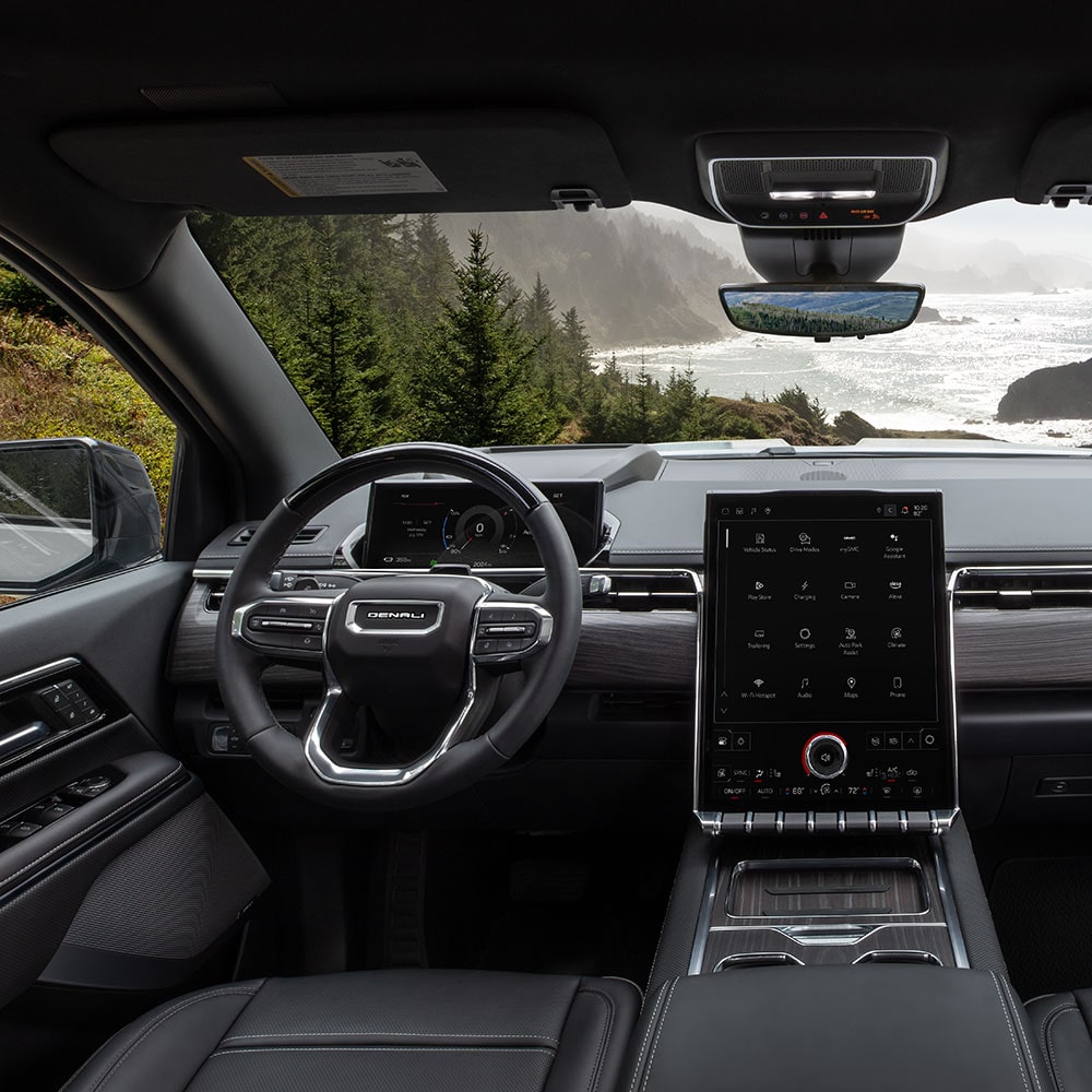 Interior View of the Steering Wheel, Dashboard, and Infotainment Screen in the GMC Sierra Truck