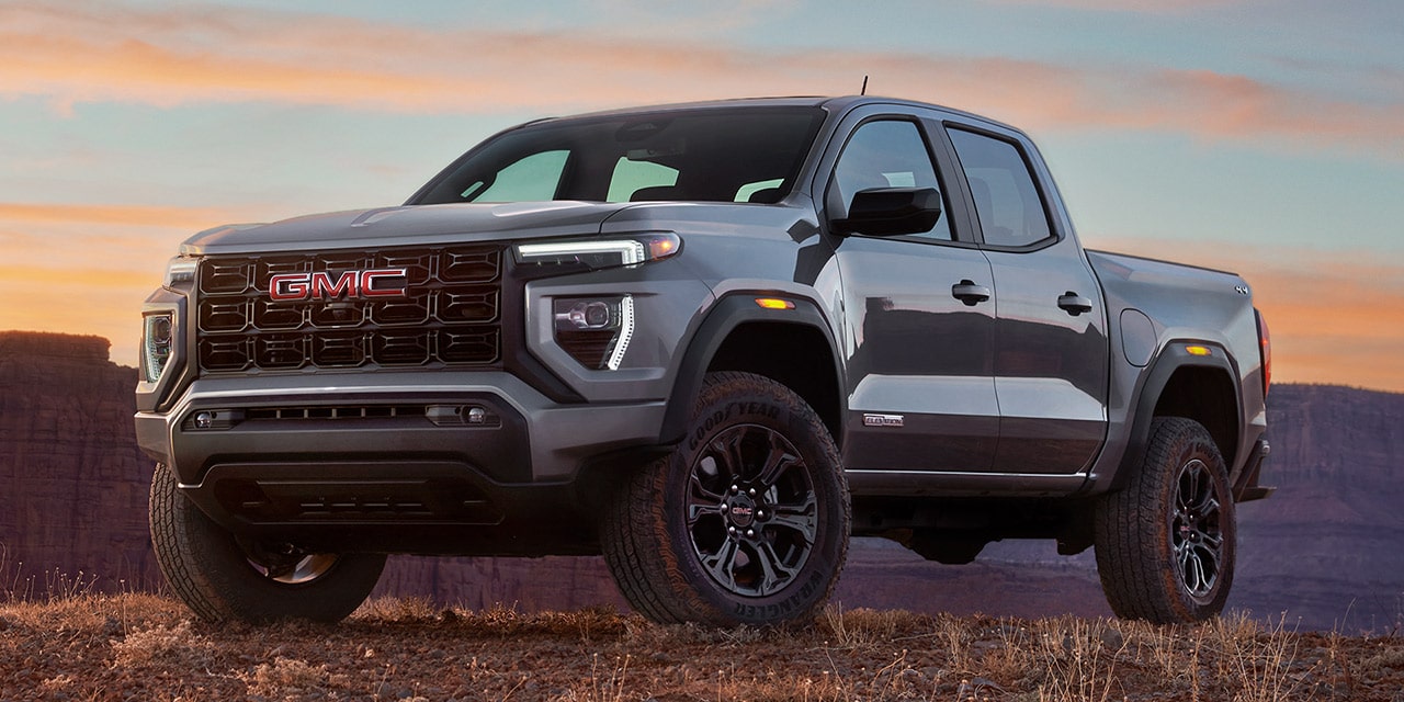 Exterior View of a GMC Canyon Pickup Truck Parked Off-Road Over Rough Terrain