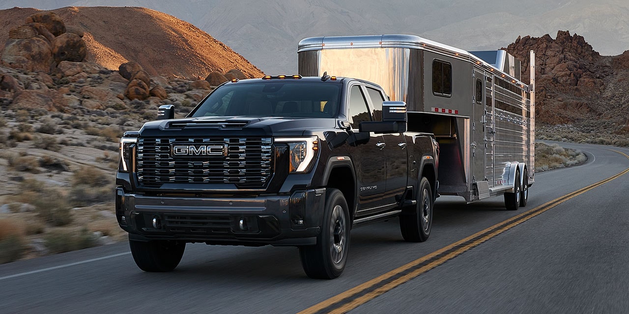 The GMC Sierra HD Pickup Truck Towing a Trailer