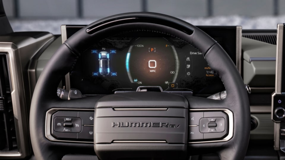 Driver’s View of the Steering Wheel and the Speedometer Dashboard for GMC Hummer EV SUV