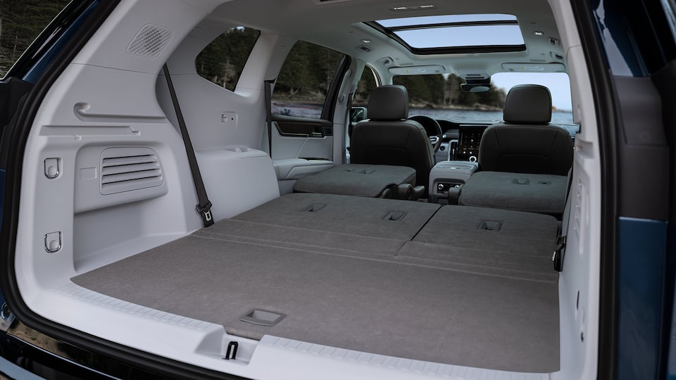 View of the Trunk and Rear Seating Folded Down in a 2024 GMC Acadia Denali SUV