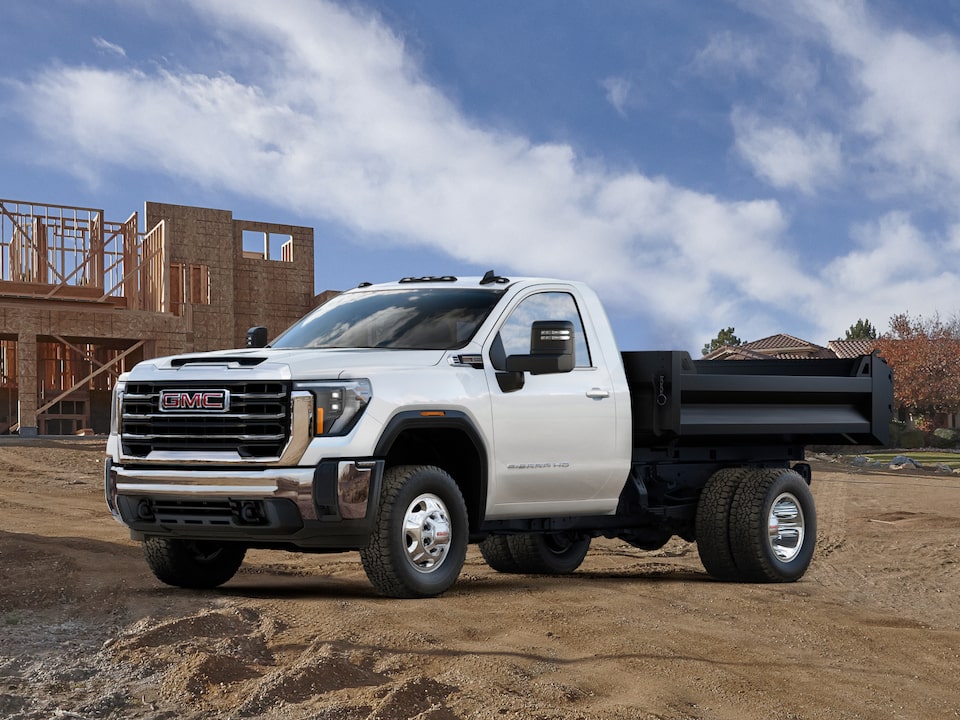 A GMC Truck with the Dump Truck Upfit at a Construction Site