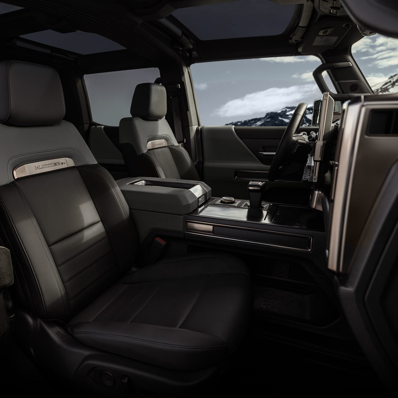 Interior View of the Steering Wheel and Infotainment Screen in the GMC HUMMER Electric Truck