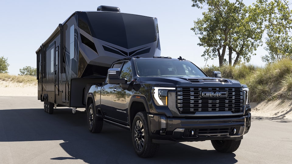 A Parked GMC Sierra HD With a Trailer on the Hitch