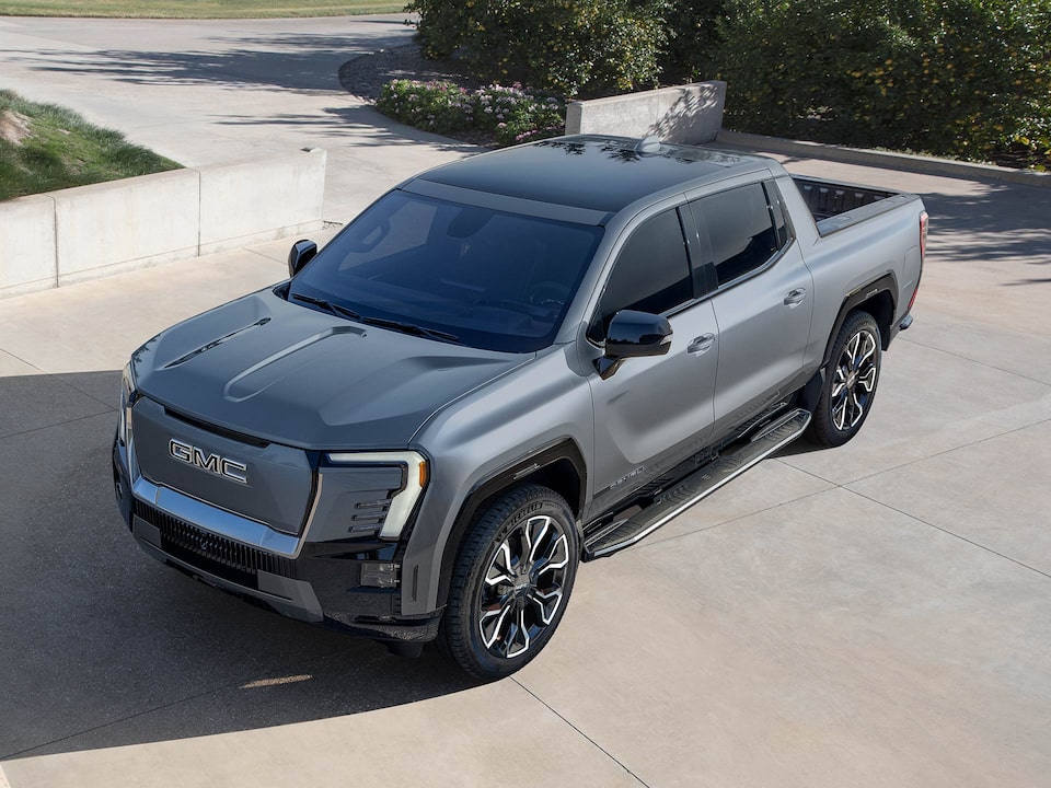 Front Three-Quarter View of a Silver 2025 GMC Sierra EV Denali Pickup Truck